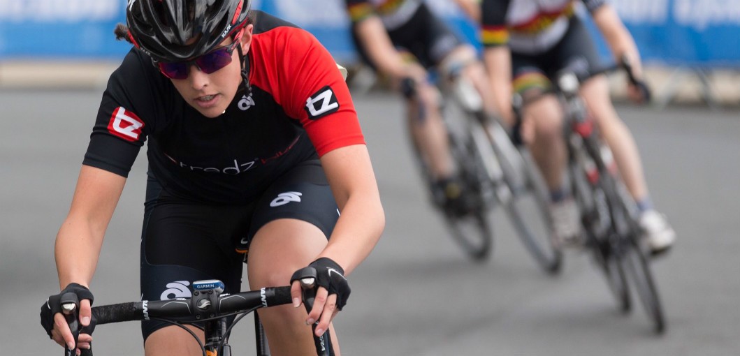 Close up of danni in action racing other road riders